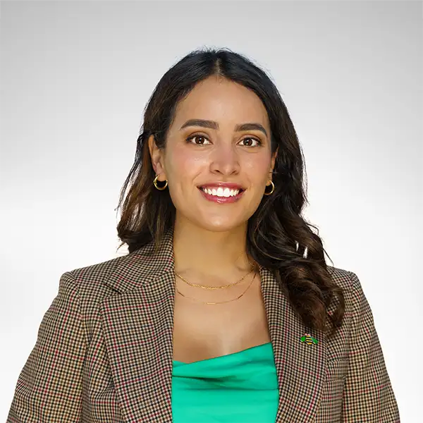 Professional headshot of a smiling woman in a blazer
